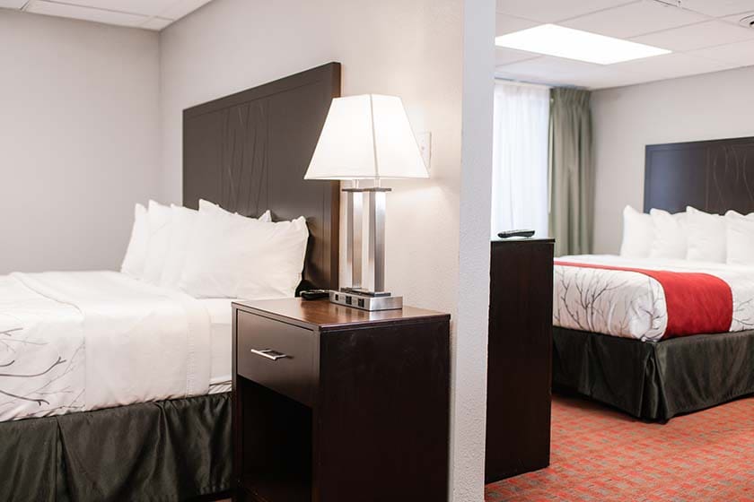 Room with two Queen beds, desk, microwave/fridge, sofa sleeper, kitchenette