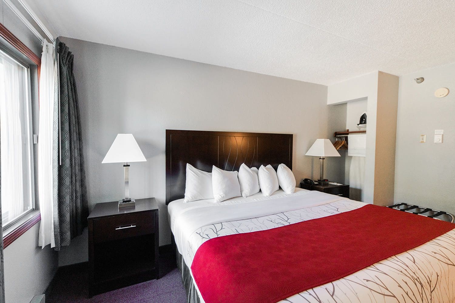 View of the single room with a king bed